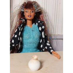 Barbie doll. Modern vase. Beige
