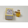 Casa muñecas 1:12. Perfume miniatura con caja. Amarillo